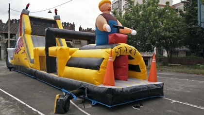 inflatable kids playing obst...