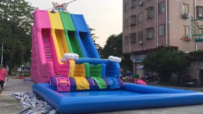 inflatable rainbow slide wit...